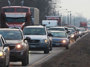 Northbound traffic on Ojibway Parkway is redirected onto Broadway Boulevard after a transport truck struck a hydro pole closing both north- and southbound lanes of Ojibway Parkway, Tuesday, Jan. 14, 2014.  (DAX MELMER/The Windsor Star)