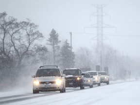 Motorists commute in poor driving conditions on Highway 3 near Sexton Side Road, Sunday morning, Jan. 26, 2014.  Emergency services have been responding to dozens of accidents due to unsafe driving conditions.   (DAX MELMER/The Windsor Star)