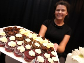 Zuzana Hriesik, owner of Sweet Sisters Bakery, displays some mini cupcakes at the 27th Annual Wedding Extravaganza at the Caboto Club, Sunday, Jan. 19, 2014.  (DAX MELMER/The Windsor Star)