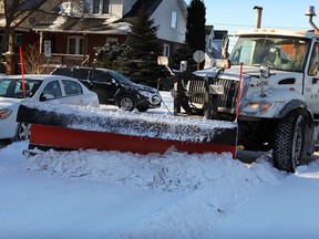 Tight corner for this Amico Construction snow plow on Ellis Street East at Marentette Avenue Friday January 3, 2014. (NICK BRANCACCIO/The Windsor Star)