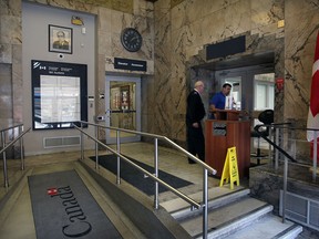 Lobby entrance to Right Honourable Paul Martin Sr. Building at 185 Ouellette Avenue, owned by Government of Canada,  January 21, 2014. Public spaces – Ouellette Avenue entry lobby and Post Office lobby – with walls lined with marble, ceilings decorated with polychrome plasterwork and floors with geometric terrazzo designs. (NICK BRANCACCIO/The Windsor Star)
