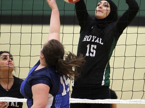 Lajeunesse's Mariam Elkaafarani, right, blocks a shot by Walkerville's Megan Power at Lajeunesse Monday. (TYLER BROWNBRIDGE/The Windsor Star)