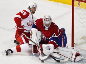 Detroit's Darren Helm, left, collides with Montreal goalie Carey Price. (Dario Ayala/THE GAZETTE)