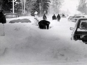 Motorists dig themselves out following a snowstorm on Jan. 26, 1978 that wreaked havoc on over half the continent. The storm claimed the lives of four people and about 35,000 people in Windsor and Essex County were without power for hours. (FILES/The Windsor Star)