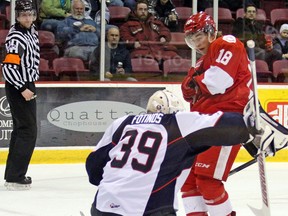 Windsor goalie Alex Fotinos, left, makes a save on Blake Speers of the Greyhounds. (J. Ougler/Sun Media)