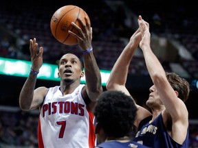 Detroit's Brandon Jennings, left, goes to the basket against Jeff Withey, middle right, and forward Al-Farouq Aminu of the Pelicans Friday. (AP Photo/Duane Burleson)