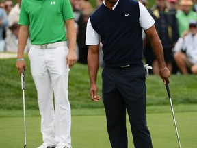 Tiger Woods, right, looks at a putt in front of Jordan Spieth at the Farmers Insurance Open on Torrey Pines South. (Photo by Robert Laberge/Getty Images)