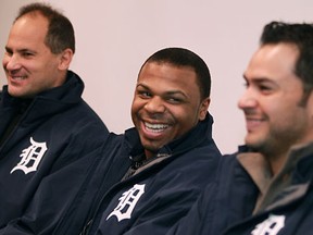 Members of the Detroit Tigers, from left, coach Omar Vizquel, outfielder Rajai Davis, and pitcher Anibal Sanchez, share a laugh while visiting with the Canada Border Services Agency for the Tigers Winter Caravan in downtown Windsor Friday. (DAX MELMER/The Windsor Star)