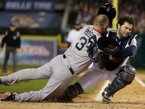 Boston's David Ross, left, collides with Tigers catcher Alex Avila in Game 5 of the American League championship series. (AP Photo/Matt Slocum)