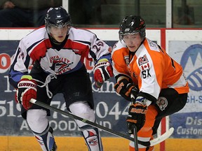 Essex forward Daniel Slipchuk, right, is checked by Wheatley's Thomas Virban at the Essex Centre Sports Complex. (TYLER BROWNBRIDGE/The Windsor Star)