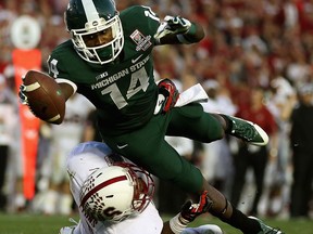 Spartans wide receiver Tony Lippett scores a touchdown in the fourth quarter of the 100th Rose Bowl Game against the Stanford Cardinal. (Photo by Jeff Gross/Getty Images)