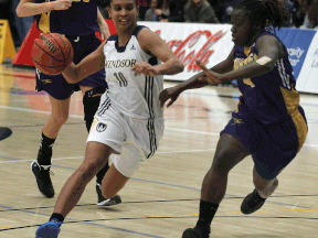 Windsor's Miah-Marie Langlois, left, drives by Laurier's Lee Anna Osei Wednesday at the St. Denis Centre. (DAN JANISSE/The Windsor Star)
