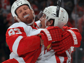 Detroit's Johan Franzen, left, celebrates with Justin Abdelkader after scoring a goal against the Avalanche. (Photo by Doug Pensinger/Getty Images)