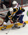 Spits defenceman Trevor Murphy, right, is checked by Kingston’s Spencer Watson at the WFCU Centre. (TYLER BROWNBRIDGE/The Windsor Star)