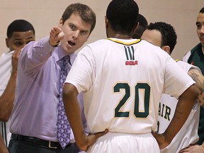St. Clair basketball coach Matt Devin, left, talks to a player against Redeemer University College in 2011. (DAN JANISSE/The Windsor Star)