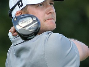 Kingsville golfer Richard Scott eyes a tee shot at Ambassador Golf Club in 2011. (DAN JANISSE/The Windsor Star)