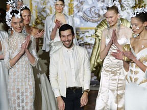French fashion designer Alexis Mabille acknowledges the public during his Haute Couture Spring-Summer 2014 collection show, on January 20, 2014 in Paris.    (MIGUEL MEDINA/AFP/Getty Images)