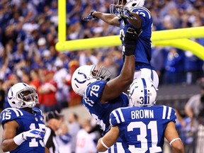 Colts receiver T.Y. Hilton, top, celebrates a fourth-quarter touchdown against the Kansas City Chiefs Saturday at Lucas Oil Stadium. (Photo by Andy Lyons/Getty Images)