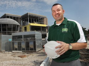 St. Clair athletic co-ordinator Ted Beale poses in front of the Sportsplex construction project. (DAN JANISSE/The Windsor Star)