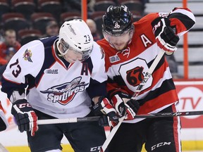 Windsor's Remy Giftopoulos, left, battles Ottawa's Taylor Fielding at the Canadian Tire Centre in Ottawa. (Photo by Jean Levac/Ottawa Citizen)