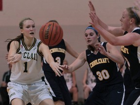 St. Clair's Kelly Rizea, left, passes the ball against Schoolcraft College. (JASON KRYK/The Windsor Star)