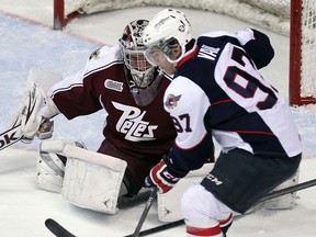 Windsor's Brady Vail, right, is stopped by Petes goalie Andrew D'Agostini at the WFCU Centre. (TYLER BROWNBRIDGE/The Windsor Star)