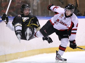 LaSalle's Nathan Savage, left, goes airborne after colliding with Cleo Gubbles of the Predators at the Vollmer Centre. (TYLER BROWNBRIDGE/The Windsor Star)