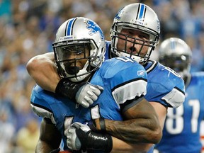 Detroit's Jahvid Best celebrates a TD with teammate Stephen Peterman during the game against Kansas City at Ford Field on September 18, 2011 in Detroit. (Leon Halip/Getty Images)