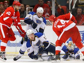 Detroit's Gustav Nyquist, right, scores against the St. Louis Blues in the first period Monday, Jan. 20, 2014, in Detroit. (AP Photo/Paul Sancya)
