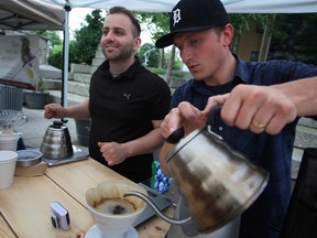 Dane Charles, left, and Jim Lasorda, from Whipsaw Coffee, serve freshly brewed coffee back in June at the Downtown Windsor Farmer's Market  at Charles Clark Square. Whipsaw Coffee captured an award last month for its Ethiopian Yirgacheffe blend at America's Best Espresso competition in Chicago. (DAX MELMER / Windsor Star files)