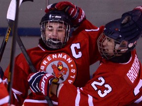 Brennan's Nathan Zakoor, left, and Jared Brothers celebrate a goal against Belle River during their game Monday, Jan. 20, 2014, at the Lakeshore Arena. (DAN JANISSE/The Windsor Star)