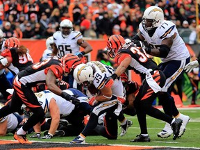 Running back Danny Woodhead, centre, of the San Diego Chargers scores a touchdown against the Bengals during a wild card Playoff game January 5, 2014 in Cincinnati.  (Rob Carr/Getty Images)