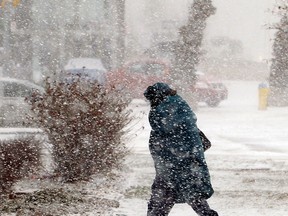 A pedestrian braves the elements in downtown Windsor in this Jan. 2013 file photo. (Jason Kryk / The Windsor Star)
