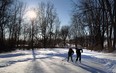 Brendan Semande and Ethan Shurgold (right) brave the cold as they play some outdoor hockey on the pond at Malden Park in Windsor on Tuesday, January 28, 2014.                        (TYLER BROWNBRIDGE/The Windsor Star)