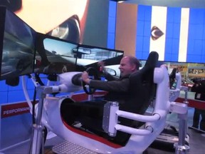 Craig Pearson tries out a driving simulator at the 2014 Detroit auto show. (Jason Kryk/Screen Grab/The Windsor Star)