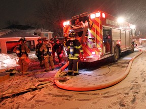 Firefighters battle a fire at 1794 Dominion Blvd. in Windsor on Thursday, January 30, 2014. The blaze caused extensive damage to the inside of the house.                             (TYLER BROWNBRIDGE/The Windsor Star)