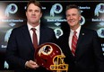 Jay Gruden, left, poses with Washington Redskins executive vice-president and GM Bruce Allen after he was introduced as the new head coach at Redskins Park on January 9, 2014 in Ashburn, Va. (Patrick McDermott/Getty Images)