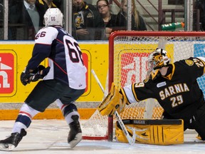 Windsor's Josh Ho-Sang scores in the shootout against Sarnia goalie Taylor Dupuis during OHL action in Sarina Sunday, Jan. 26, 2014, The Spitfires beat the Sting 8-7. (Metcalfe Photography)