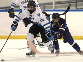 Villanova's James Brooks, left, and St. Anne's Cole Butler battle for the puck Thurs. Jan. 9, 2014, at the Vollmer Centre in LaSalle. (DAN JANISSE/The Windsor Star)