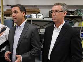 In this file photo, Tim Hudak, left, and Dave Brister at EPG Electric in Windsor on Friday, September 21, 2012.  (TYLER BROWNBRIDGE / The Windsor Star)