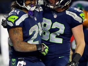 Seattle running back Marshawn Lynch, left, celebrates his TD with LaSalle's Luke Willson during the NFC Championship against San Francisco January 19, 2014 in Seattle.  (Ronald Martinez/Getty Images)