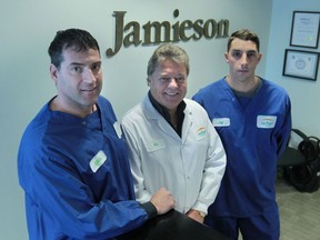 Allan Provost, plant chairperson for Unifor Local 195,  Vic Neufeld president and CEO of Jamieson Laboratories, and Jeff Semande, manufacturing operator, are shown at the Windsor production facility. (Jason Kryk/The Windsor Star)