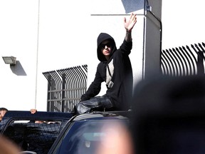 In this Jan. 23, 2014, file photo, singer Justin Bieber leaves the Turner Guilford Knight Correctional Center in Miami. A Miami-Dade County judge on Tuesday, Jan. 28 set a Feb. 14 arraignment date for the 19-year-old star on charges of DUI, resisting arrest and driving with an expired license. (AP Photo/El Nuevo Herald, Hector Gabino, File)