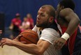 Windsor's Enrico Diloreto, left, drives to the basket against Brock in OUA men's basketball action at the St. Denis Centre, Saturday, Jan. 18, 2014. (DAX MELMER/The Windsor Star)