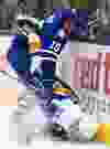 Maple Leafs defenceman Paul Ranger, right, checks New York Islanders forward Casey Cizikas in Toronto on Tuesday, January 7, 2014. (THE CANADIAN PRESS/Nathan Denette)