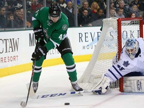 Valeri Nichushkin, left, of the Dallas Stars tries to stick handle around Toronto's Jonathan Bernier at American Airlines Center on January 23, 2014 in Dallas, Texas.  (Photo by Ronald Martinez/Getty Images)