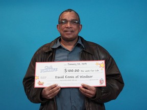 David Ennis of Windsor shows off his Instant Cash For Life prize cheque on Jan. 20, 2014. (Handout / The Windsor Star)