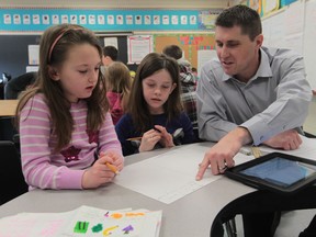 Colchester North Public School teacher Brennan Jones instructs students during math lesson on January 20, 2014.  (JASON KRYK/The Windsor Star)