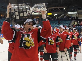 Halifax winger Jonathan Drouin, left, holds the Memorial Cup after the Mooseheads defeated the Portland Winterhawks in the finals of the 2013 Memorial Cup in Saskatoon May 26, 2013. (THE CANADIAN PRESS/Liam Richards)