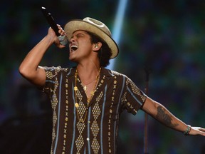 Bruno Mars, 28,  is nominated for four honors at Sunday’s Grammy Awards in Los Angeles. He's also the feature perormer at the Super Bowl halftime show. (Al Powers/Powers Imagery/Invision /AP, File)